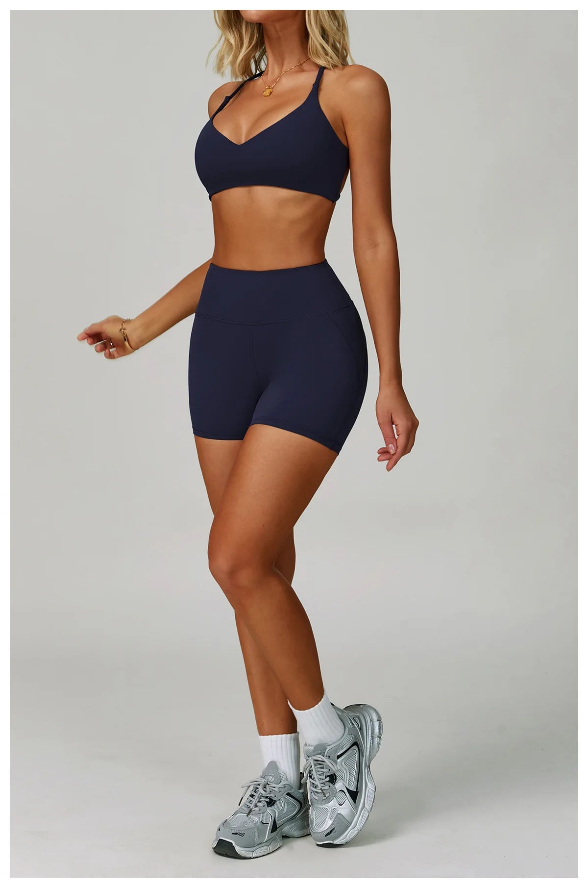 The Clothing Company Sydney women's 2-piece fitness tracksuit set with high-waist leggings and sports bra, ideal for yoga and workouts.