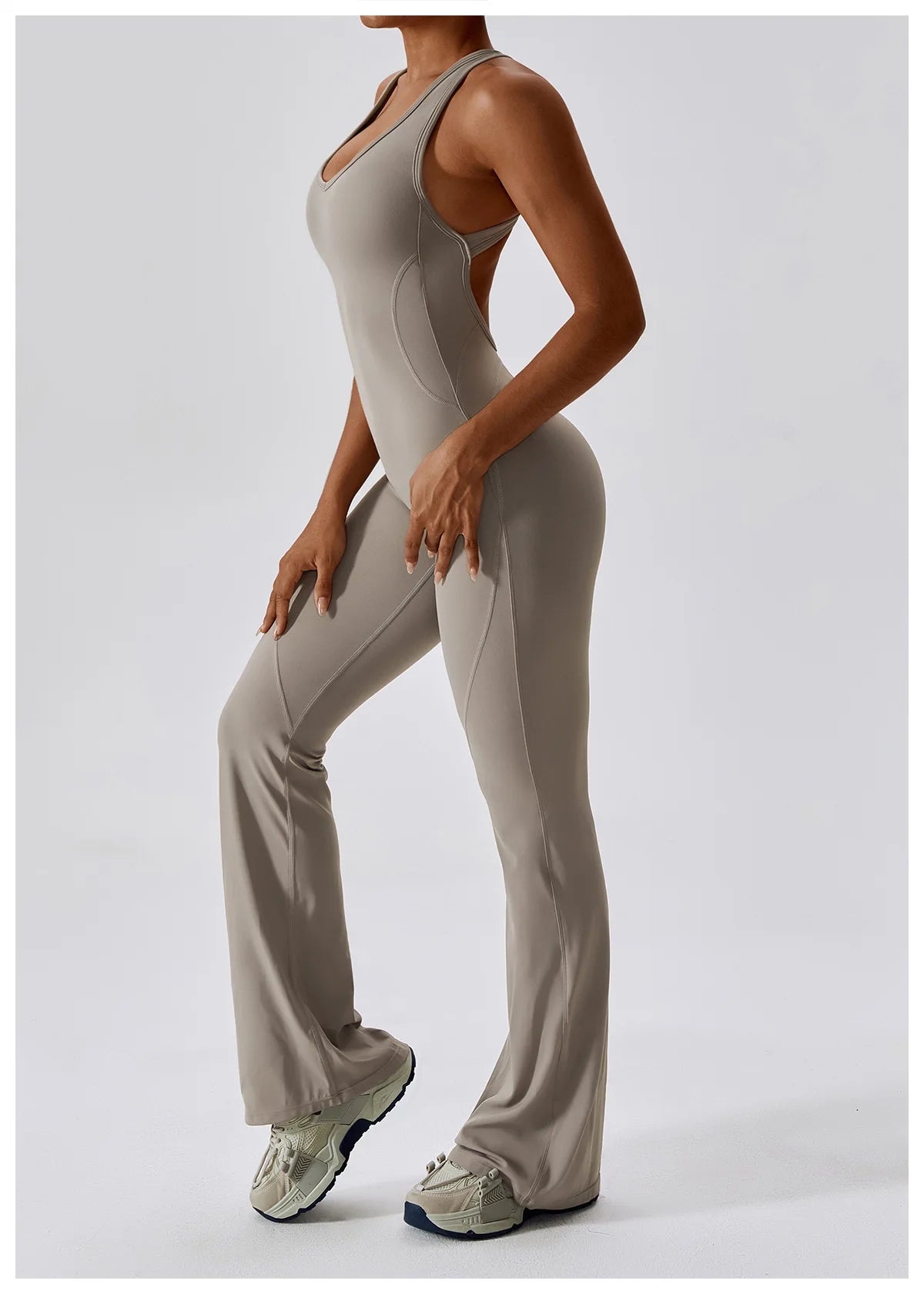 Women’s open back V jumpsuit gym set by The Clothing Company Sydney, featuring a stretch fitness bodysuit for yoga and workout training.