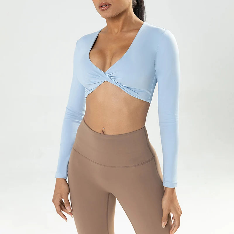 Long sleeve workout crop top by The Clothing Company Sydney featuring twist detail, deep V neckline, quick-dry fabric, padded fitness yoga shirt.