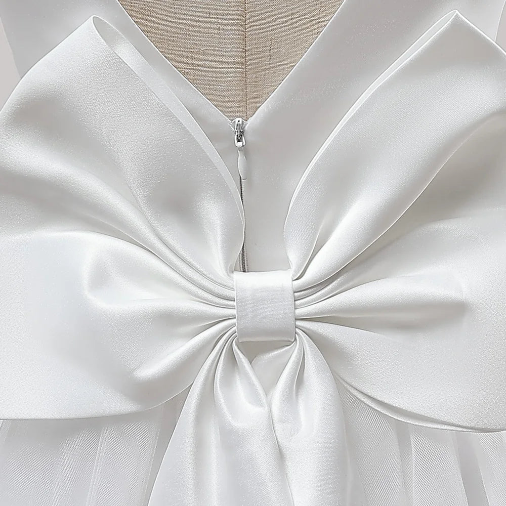 Girls' long white bridesmaid wedding prom gown with big bow, formal evening dress for kids by The Clothing Company Sydney
