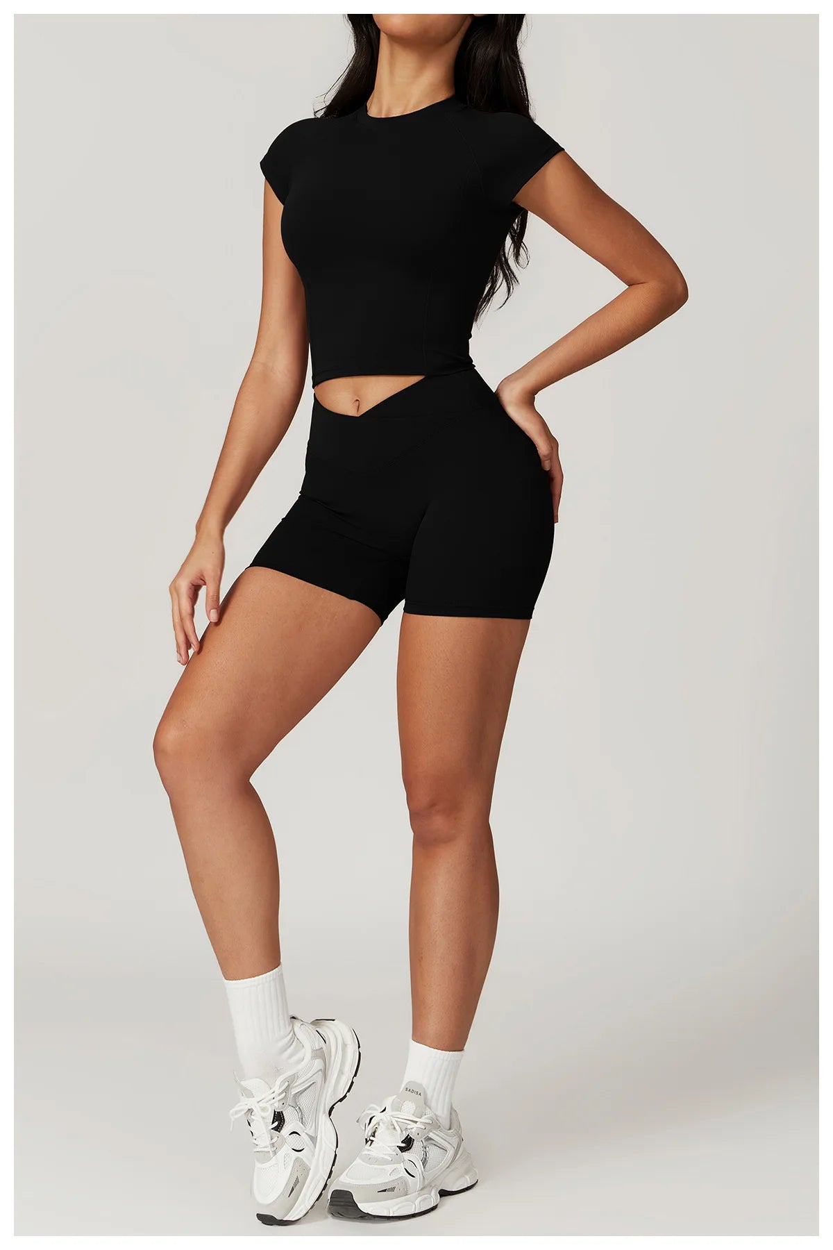Two-piece women's fitness sportswear set by The Clothing Company Sydney, includes crop top, sports bra, leggings, and bike shorts.