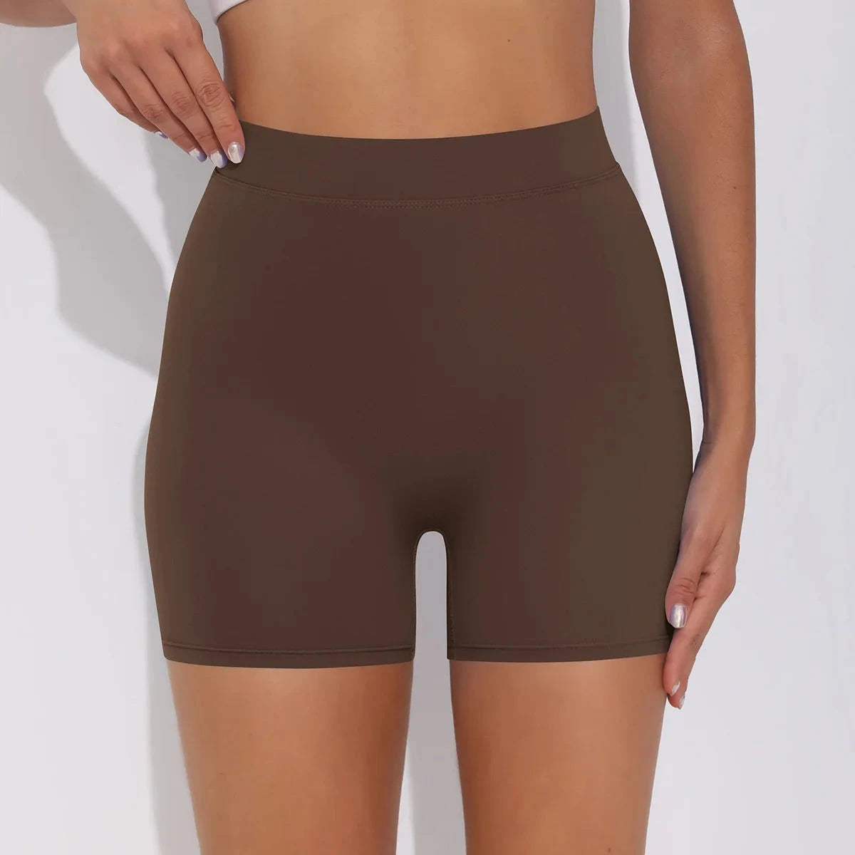 High-waisted V-back yoga shorts by The Clothing Company Sydney, form-fitting nylon fitness shorts for training and sports.
