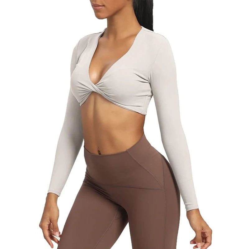 Long sleeve gym crop top by The Clothing Company Sydney, twist deep V design, quick dry fabric, padded fitness and yoga workout shirt.
