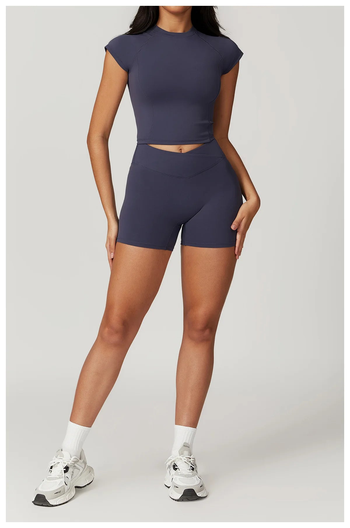Two-piece women's fitness gym set including crop top, sports bra, and leggings, from The Clothing Company Sydney.