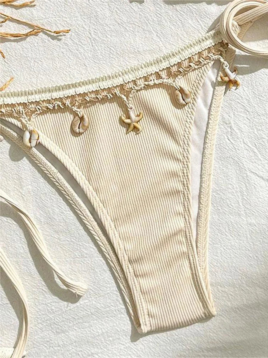 Ribbed shell-pattern bikini set for women featuring halter straps and strappy design, from The Clothing Company Sydney.