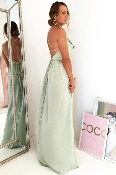 Mint green satin bridesmaid gown with side slit, backless design, spaghetti straps, long evening dress for summer events.