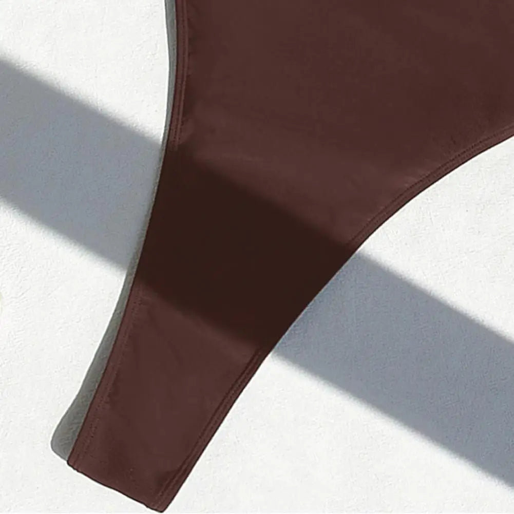 Backless micro thong one-piece swimsuit for women by The Clothing Company Sydney, featuring a sleek design and minimal coverage.