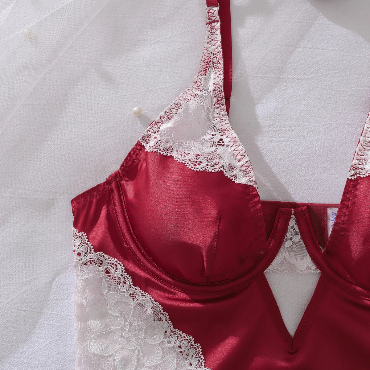 Deep-V neck satin lingerie slip dress with lace patchwork and split design, stylish nightwear for women.