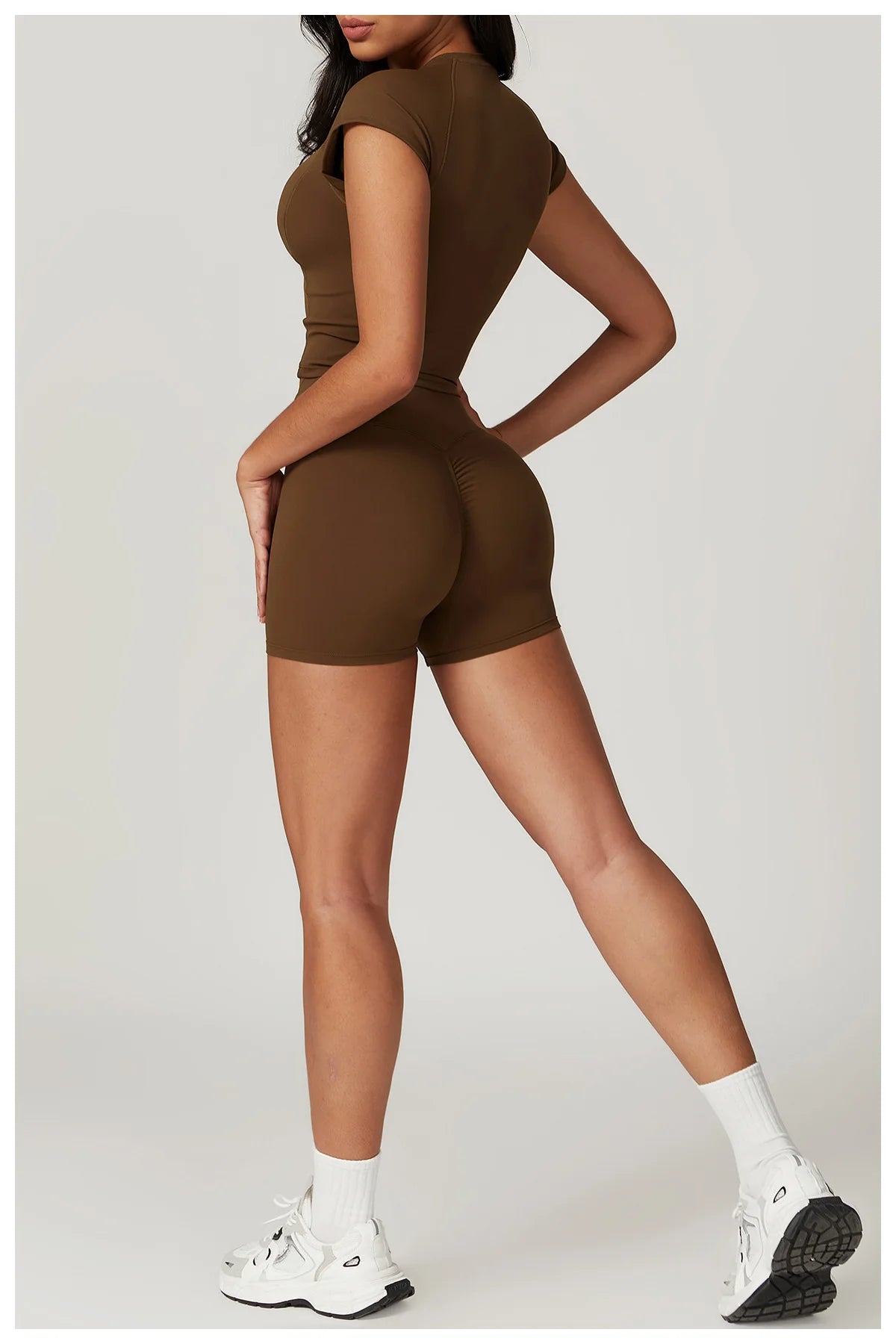 Two-piece women's fitness gym clothes set with short sleeve crop top, sports bra, and leggings from The Clothing Company Sydney.
