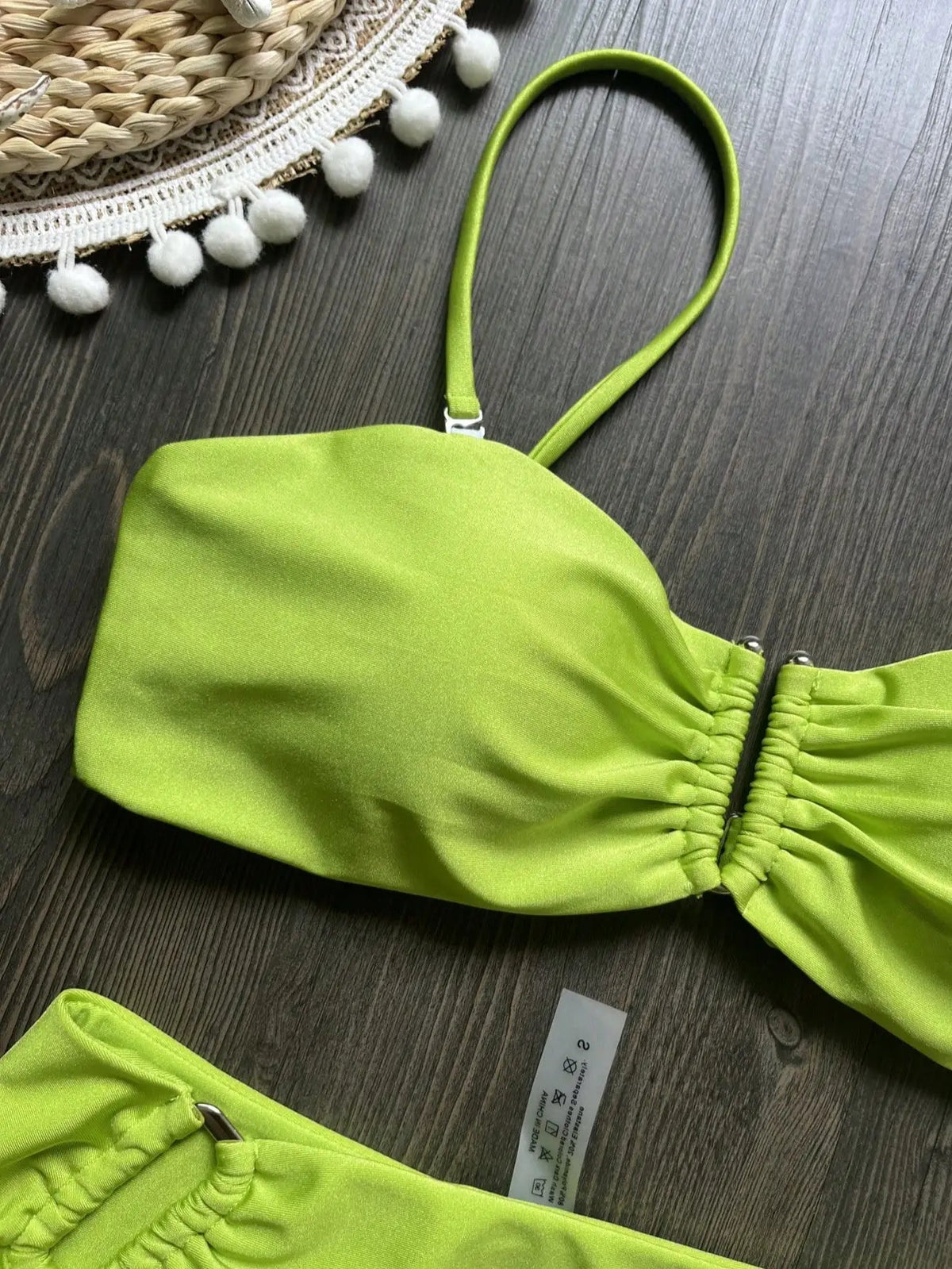 Two-piece bandeau bikini set by The Clothing Company Sydney featuring push-up top and thong bottoms in a solid beachwear style.