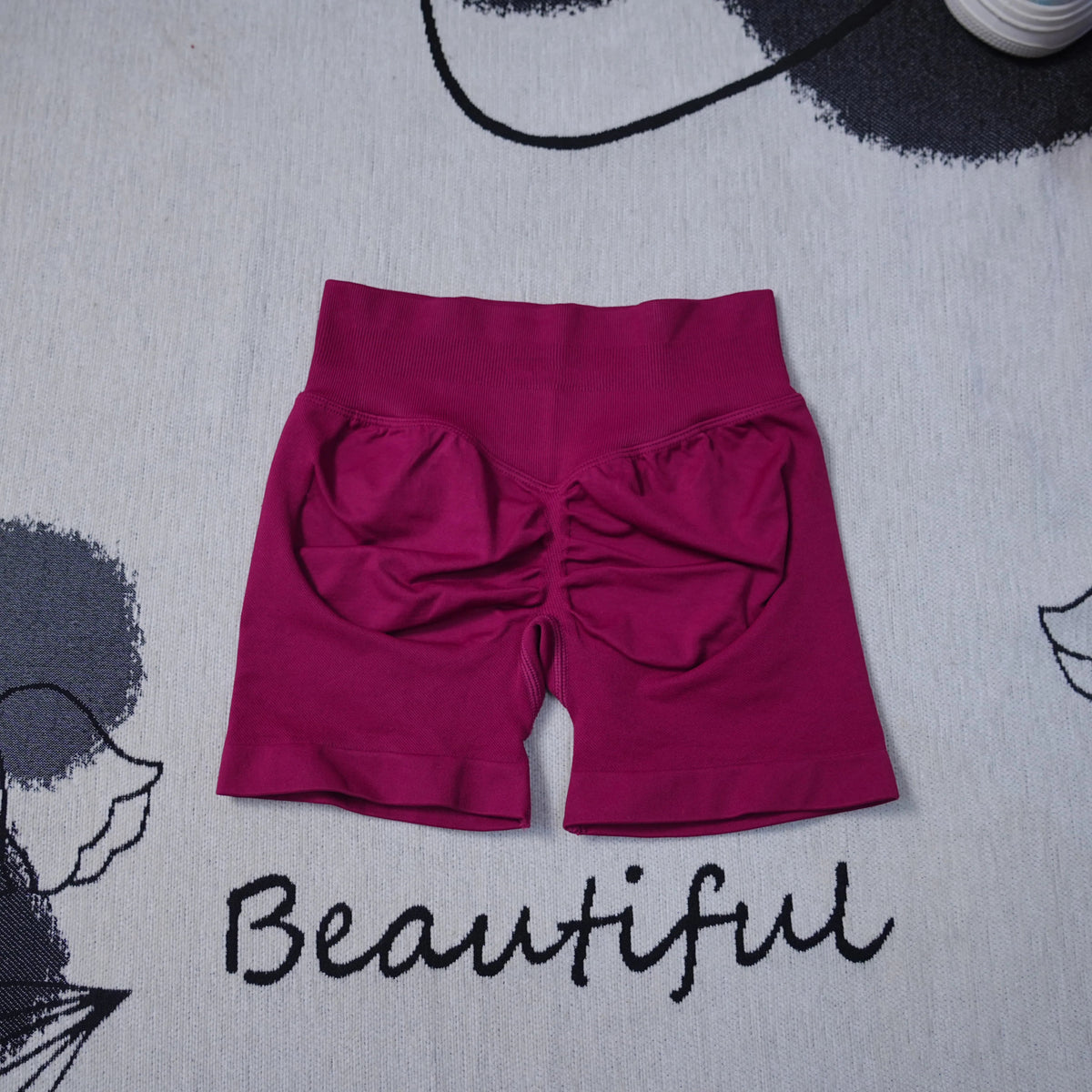 High-waisted women's seamless yoga shorts by The Clothing Company Sydney, with breathable fabric and a butt-lifting fit, for active workouts.