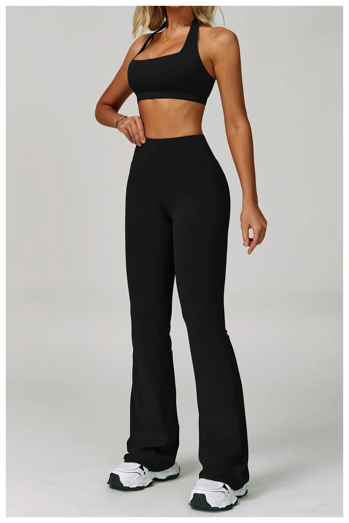 Women's fitness tracksuit set by The Clothing Company Sydney featuring high waist leggings and sports bra for workout and yoga.