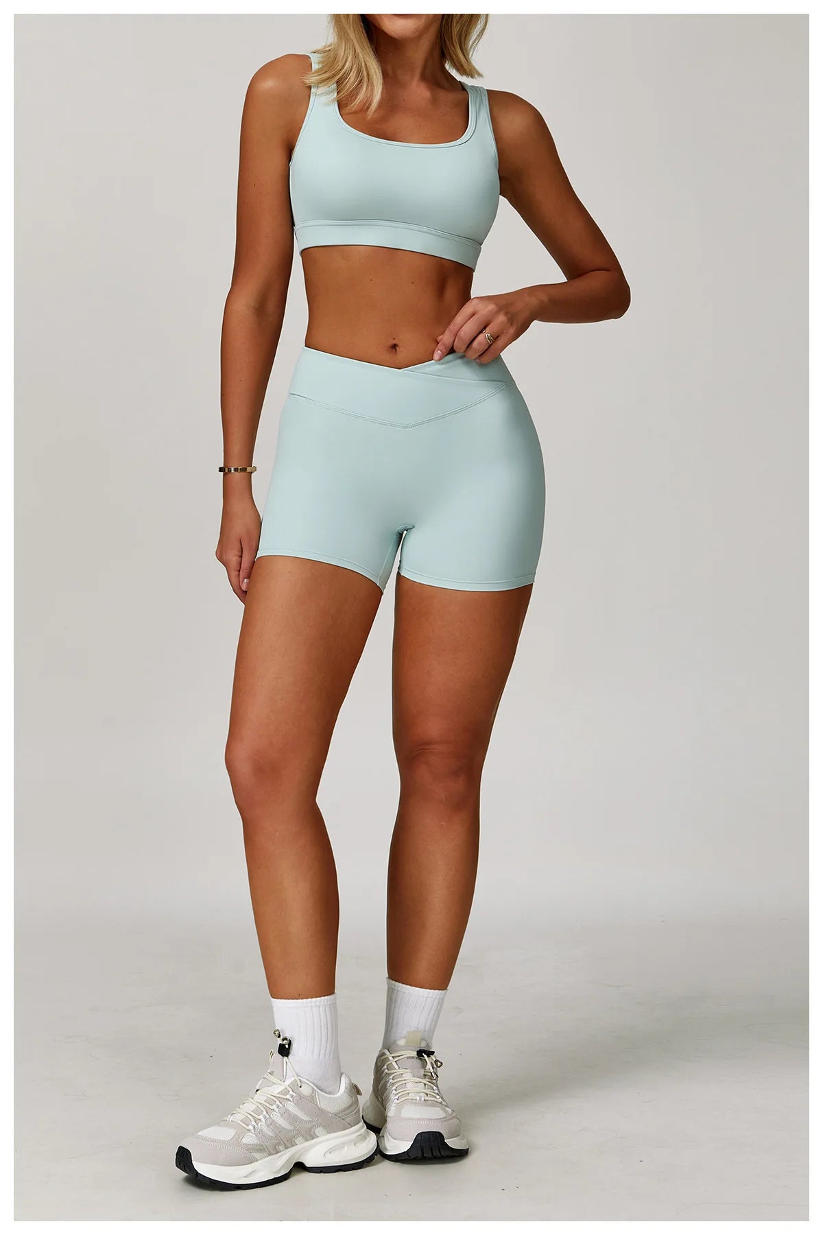 Two-piece women's fitness yoga and gym clothing set by The Clothing Company Sydney, includes sports bra and leggings in a stylish design.