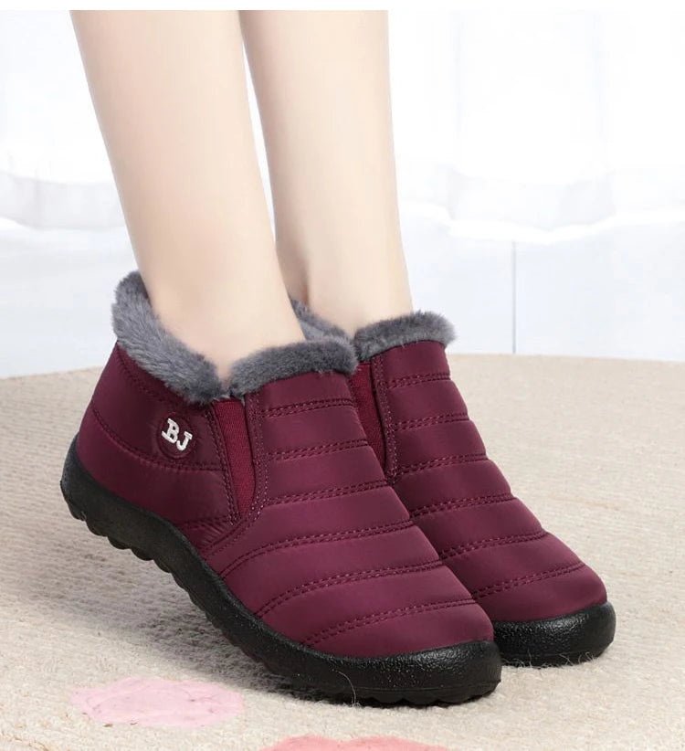 Women’s waterproof fur-lined snow boots by The Clothing Company Sydney, slip-on ankle shoes with warm, winter-ready design.