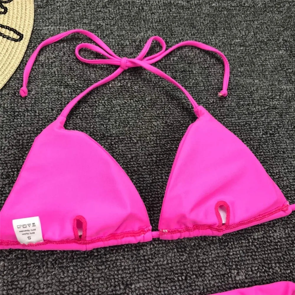 Neon pink Brazilian bikini set for women, halter style two-piece swimsuit from The Clothing Company Sydney, featuring a vibrant swimwear design.