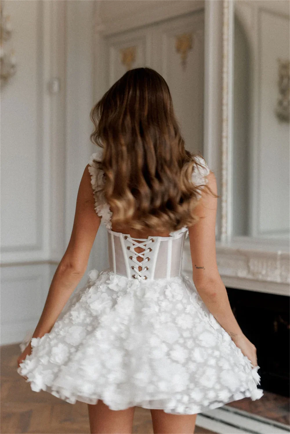 White mini prom dress by The Clothing Company Sydney featuring floral lace embroidery, sleeveless design, and spaghetti straps.