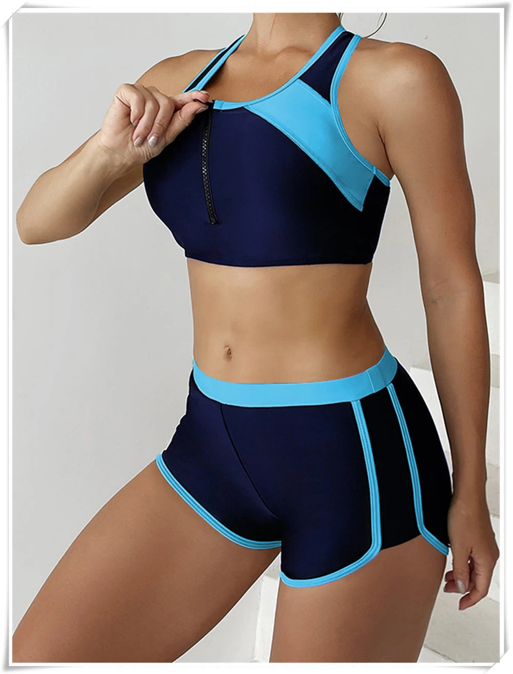 Two-piece swimsuit by The Clothing Company Sydney featuring a zipper tankini top and high-waist shorts for summer beachwear.