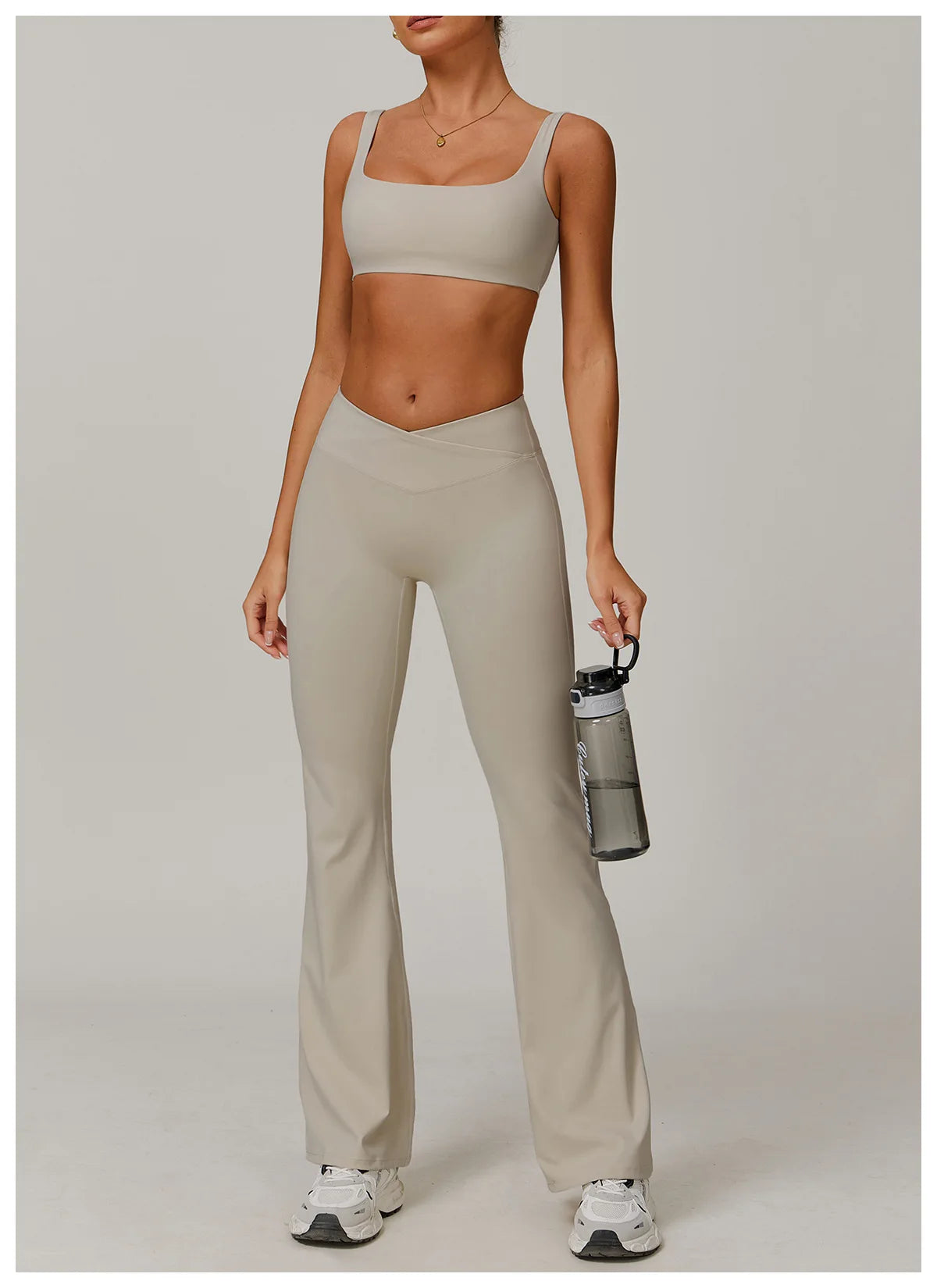 Two-piece women's fitness yoga and workout set with sports bra and leggings, ideal for gym, running, and activewear.