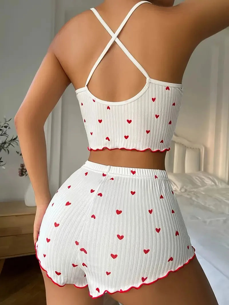 Women’s heart print pyjama set from The Clothing Company Sydney featuring a soft ribbed cami top and matching shorts with frill trim.