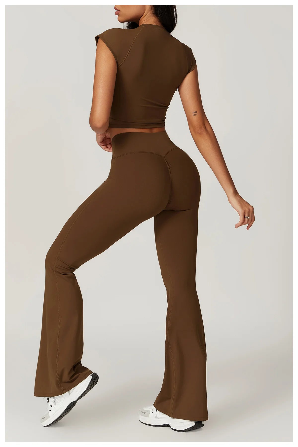 Two-piece women's fitness set with short sleeve crop top, sports bra, and gym leggings, from The Clothing Company Sydney.