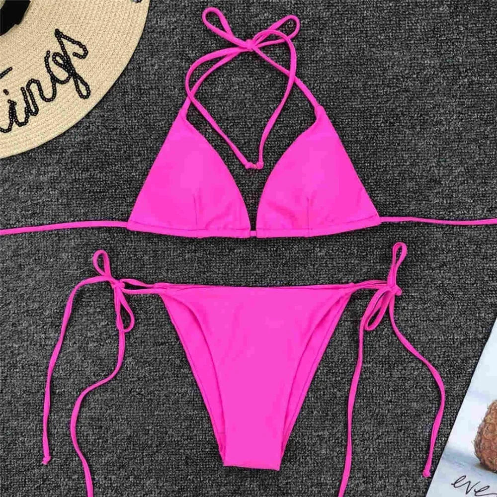 Neon pink Brazilian bikini set for women, halter top and matching bottoms, stylish two-piece swimwear by The Clothing Company Sydney.
