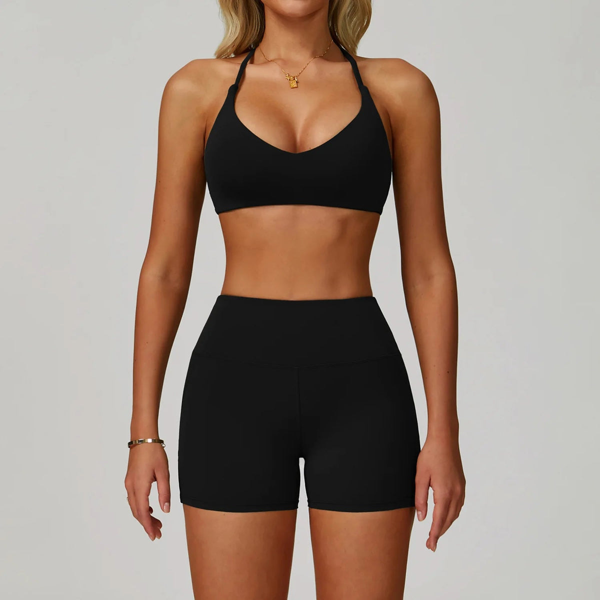 Women's fitness tracksuit set with high waist leggings and sports bra from The Clothing Company Sydney, ideal for yoga and workouts.