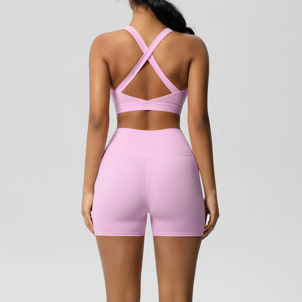 Two-piece women's sportswear set by The Clothing Company Sydney, includes yoga suits, gym shorts, crossover bra, and leggings.