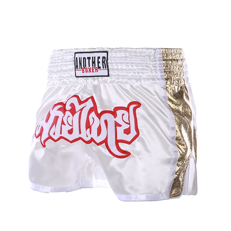 Embroidered Muay Thai boxing shorts with intricate designs, made by The Clothing Company Sydney, displayed on a plain background.