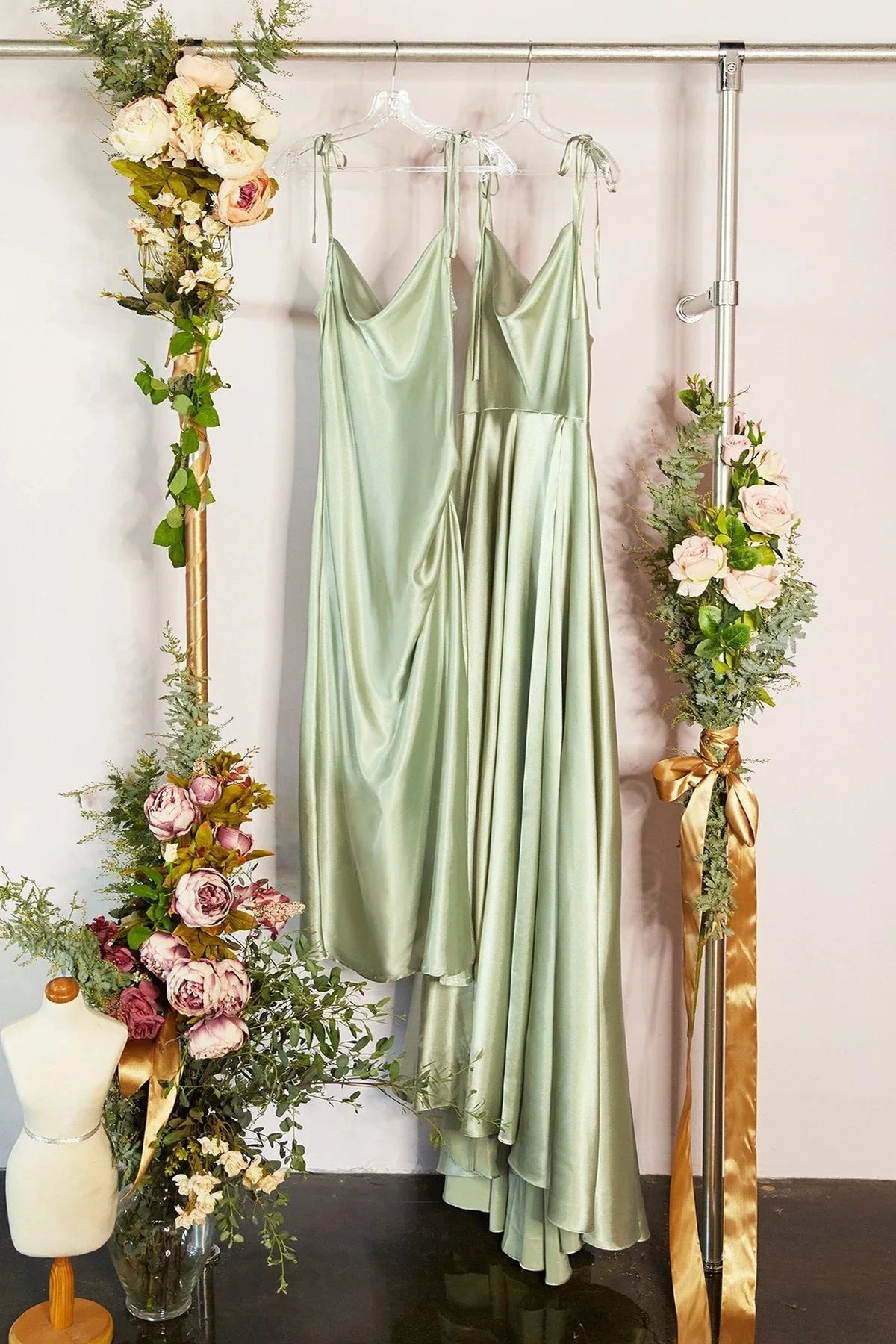 Mint green satin bridesmaid dress with side slit, backless design, spaghetti straps, perfect for summer evening weddings.