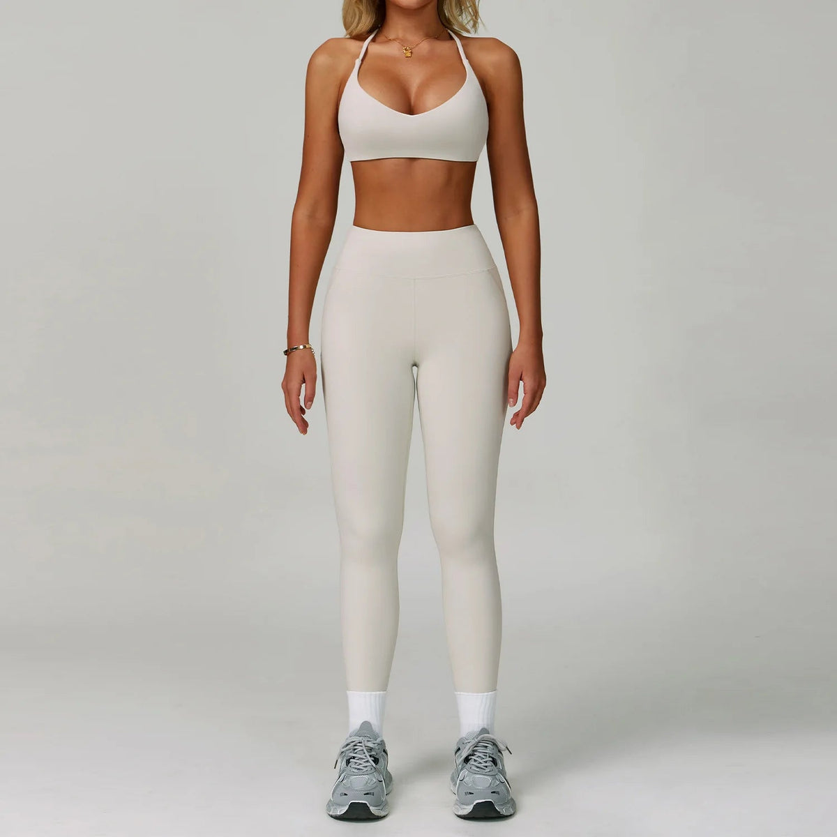 Women's fitness tracksuit set by The Clothing Company Sydney including high waist leggings and sports bra for yoga and workout.