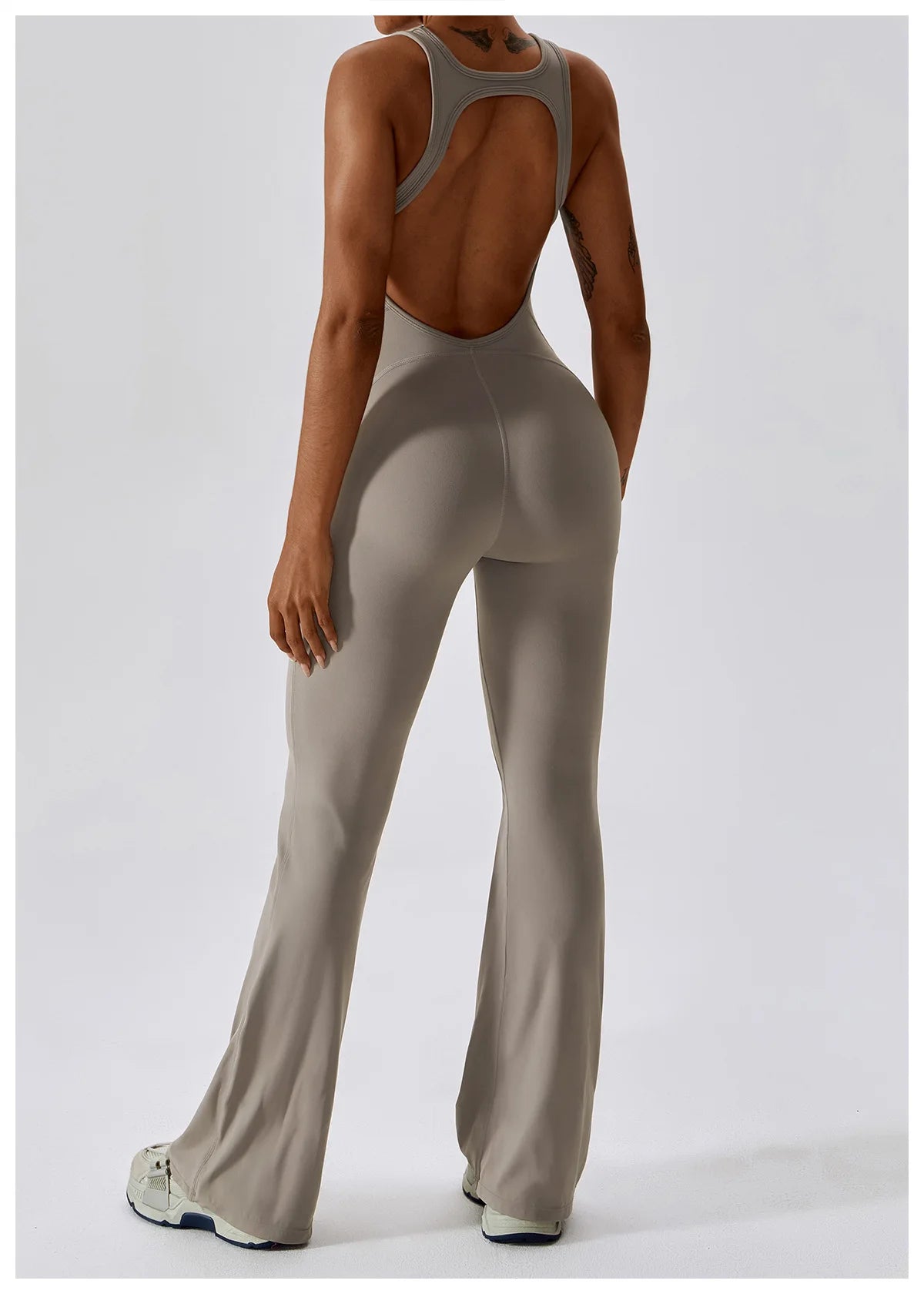 Open back V jumpsuit gym set for women, from The Clothing Company Sydney, designed for yoga, training, and fitness workouts.