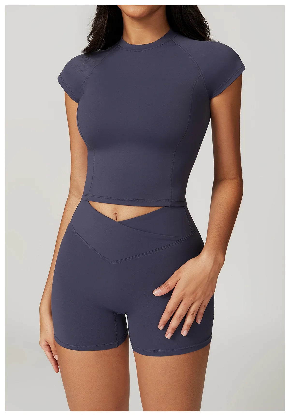 Two-piece women's fitness gym clothes set by The Clothing Company Sydney, includes sports bra, short sleeve crop top, and leggings.