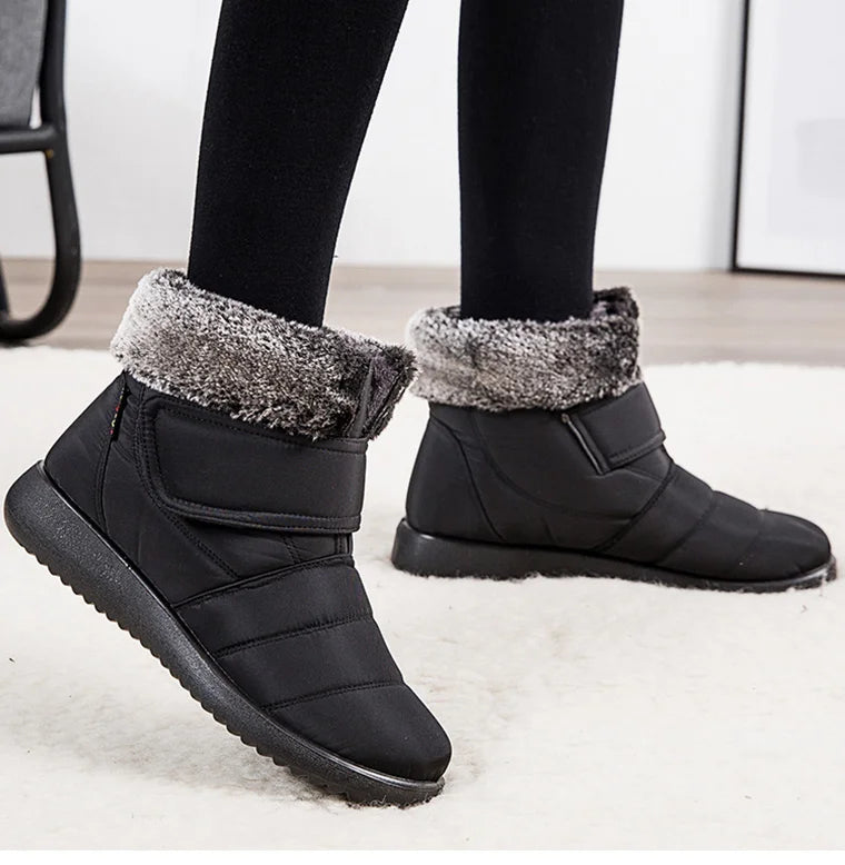 Women's fur-lined waterproof ankle boots by The Clothing Company Sydney with plush insoles and rubber soles for winter warmth.