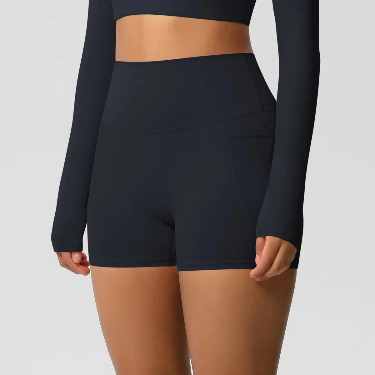 High-waisted bicycle yoga pants with pockets, quick-drying, breathable fabric, designed for women’s workout and fitness activities.
