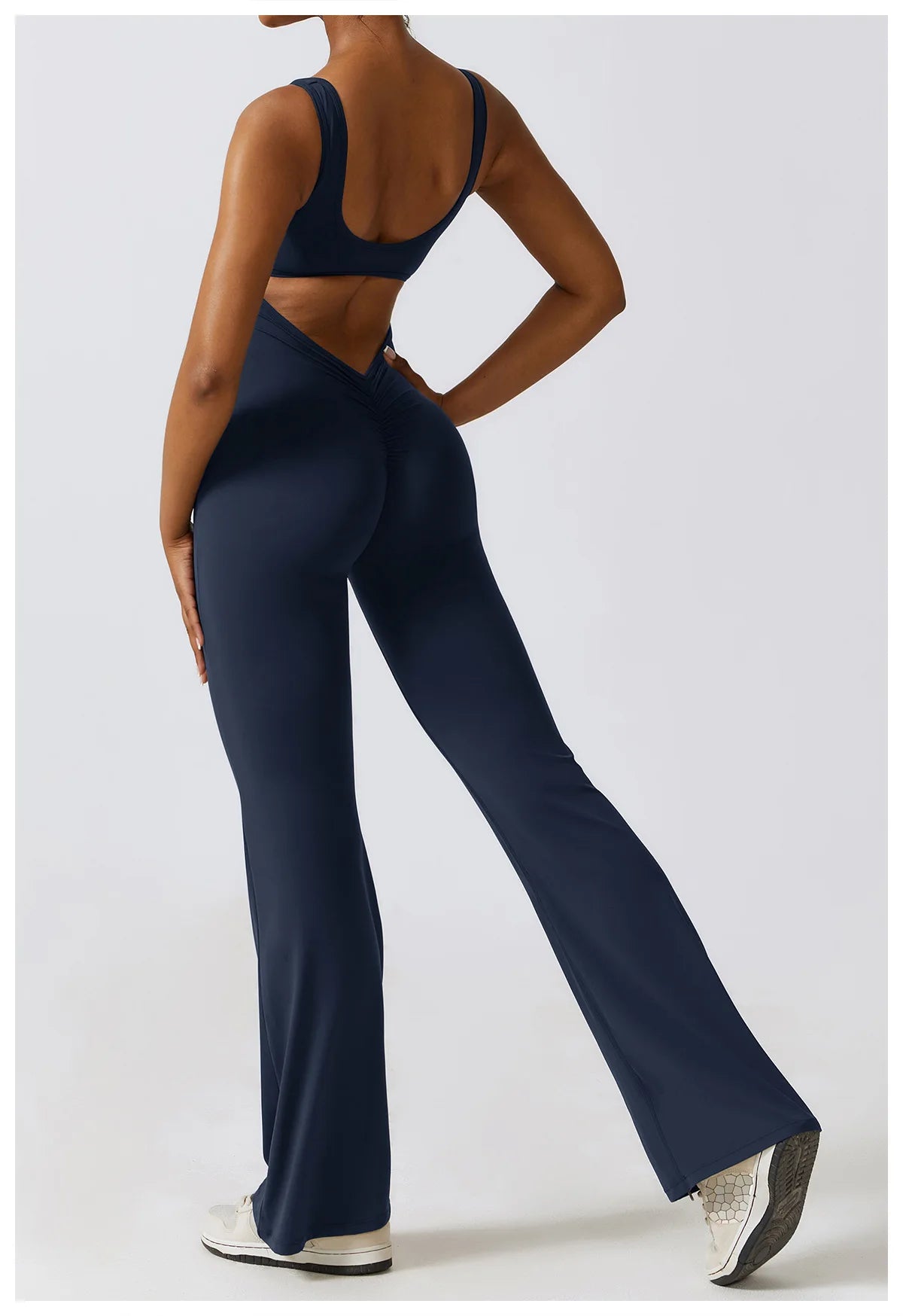 Open back V jumpsuit from The Clothing Company Sydney, a women's fitness and yoga bodysuit with stretch fabric for workout training.