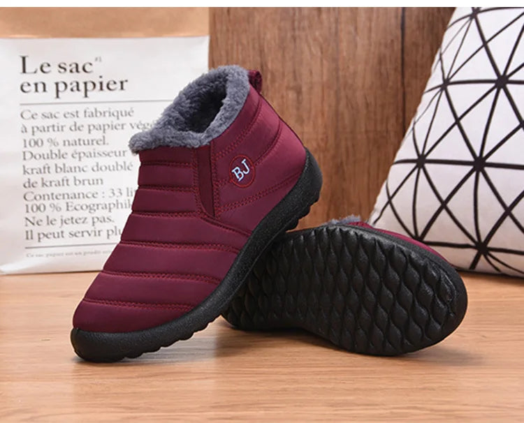 Women's waterproof fur snow boots by The Clothing Company Sydney, slip-on ankle footwear with warm lining and rugged soles.