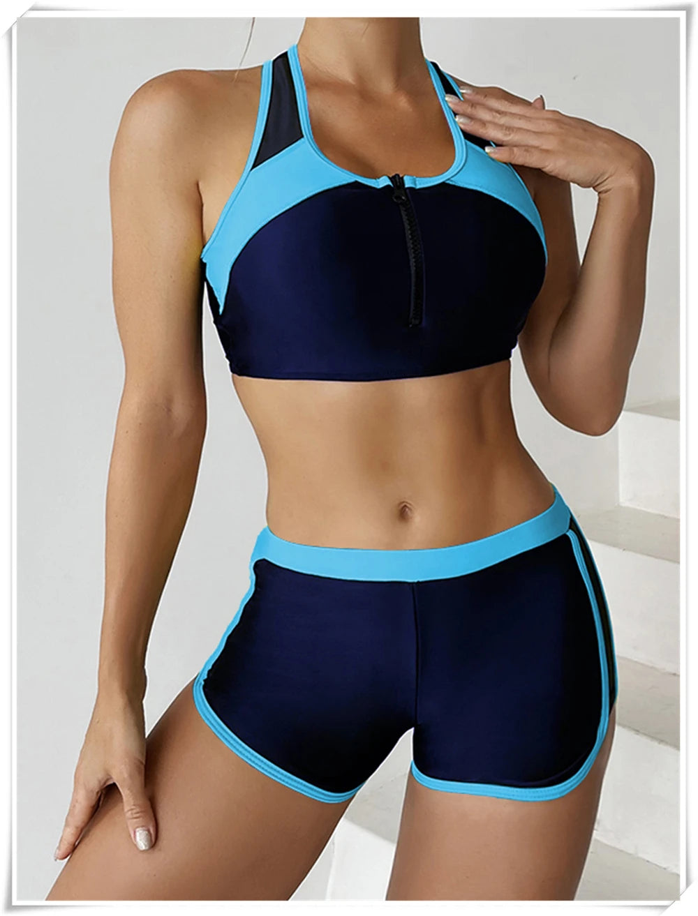 Two-piece swimsuit by The Clothing Company Sydney featuring a zipper tankini top and high-waist shorts for summer beachwear.