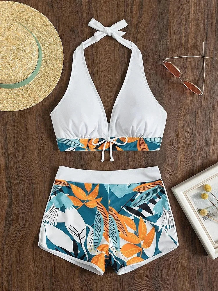 High-waist halter bikini set by The Clothing Company Sydney, featuring printed swimwear with a stylish short swimsuit design.