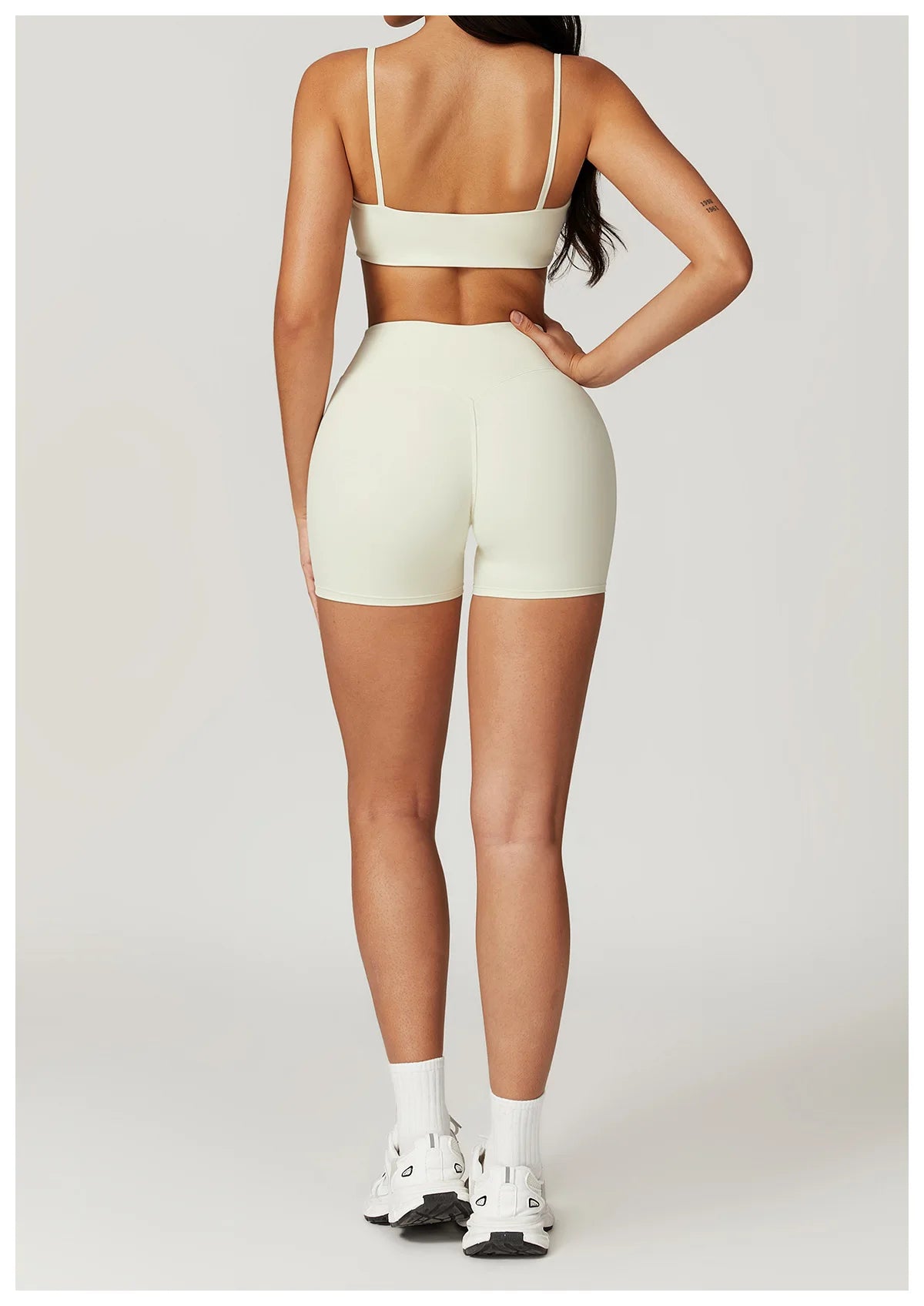 Two-piece women's fitness gym clothes set including a crop top, sports bra, and leggings from The Clothing Company Sydney.