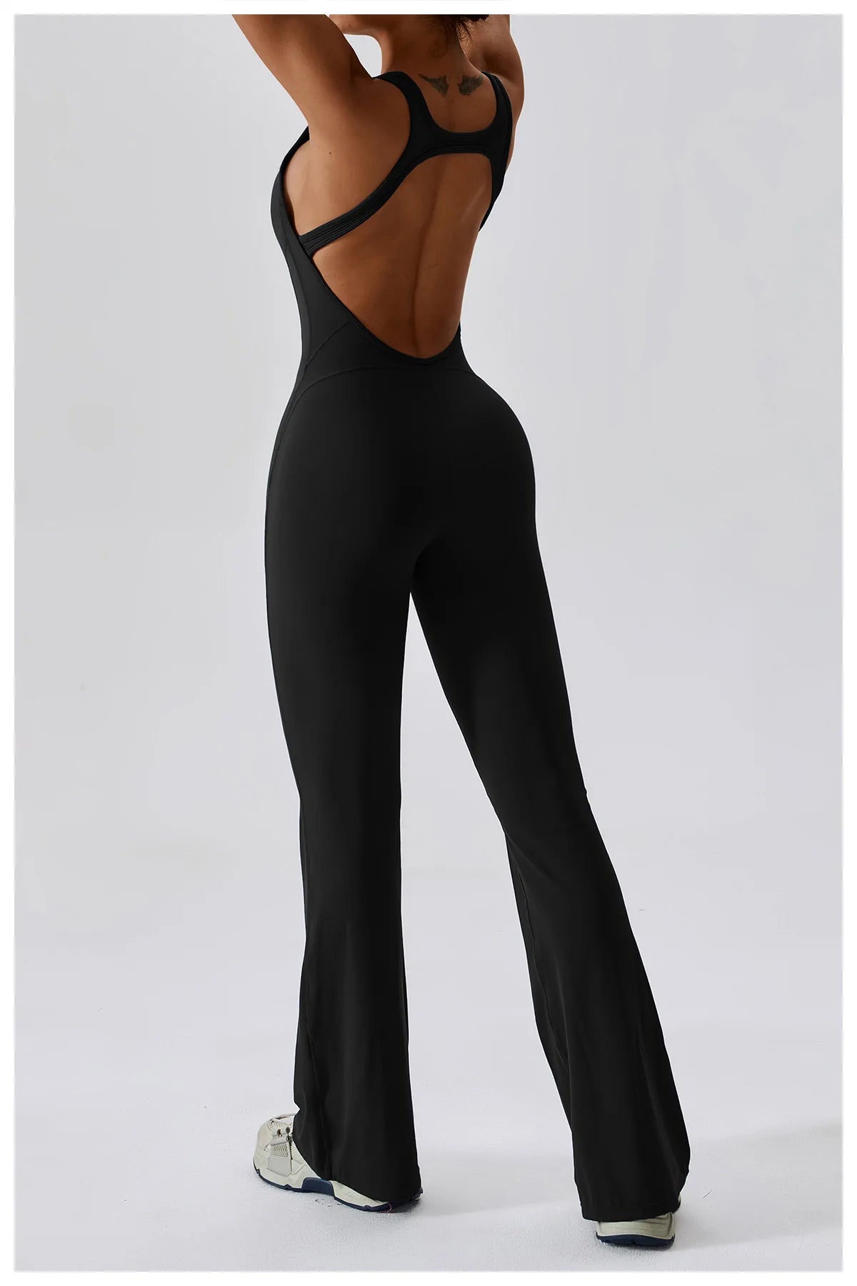 Open back V jumpsuit gym set by The Clothing Company Sydney, women's yoga and fitness sportswear romper for stretch workouts.