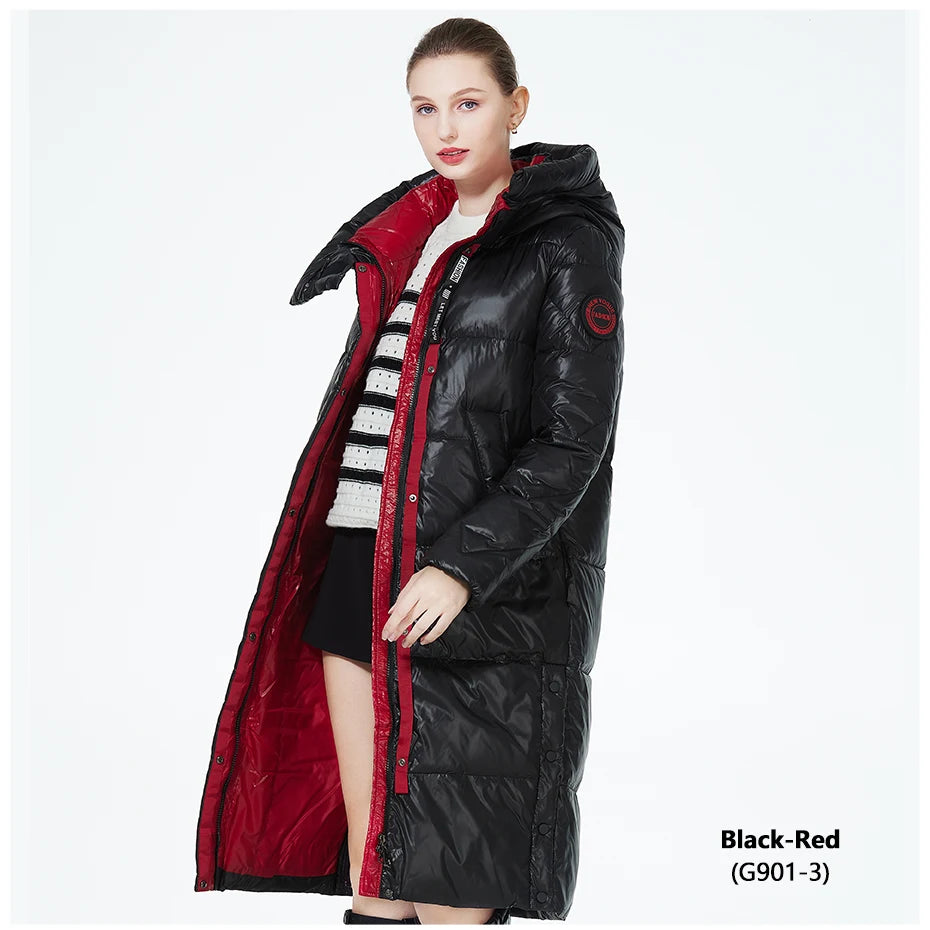 Women’s long hooded winter parka by The Clothing Company Sydney, thick quilted puffer jacket with front pockets, suitable for cold weather.