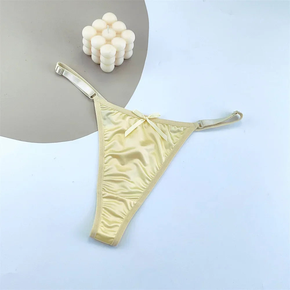 Three satin thong G-string lingerie briefs with low waist, T-back design, and bow detail from The Clothing Company Sydney.