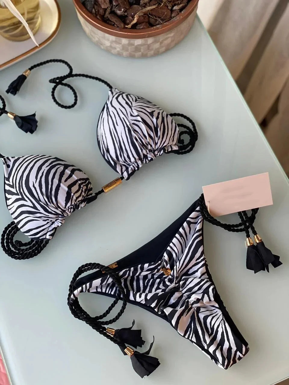 Backless women's bikini swimsuit with rope triangle top in vibrant swimwear style by The Clothing Company Sydney.