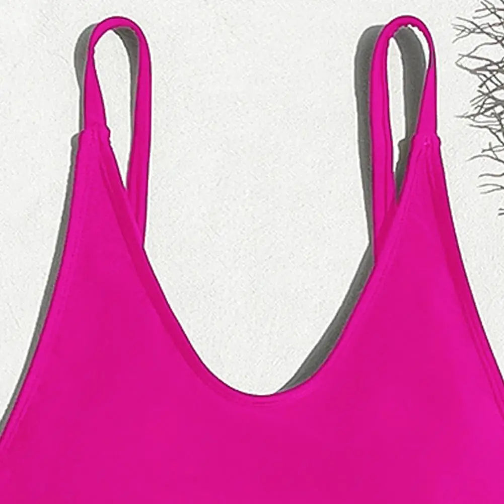 Backless micro thong one-piece swimsuit for women by The Clothing Company Sydney, featuring a sleek design and minimal coverage.