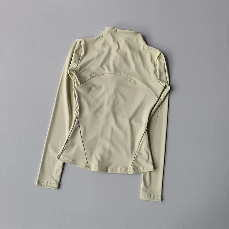Women’s slim-fit zip sports jacket by The Clothing Company Sydney, long sleeve activewear top for yoga, running, and gym workouts.