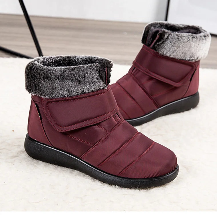 Women's fur-lined waterproof ankle boots with plush insoles and rubber soles, ideal for warm winter snow conditions.