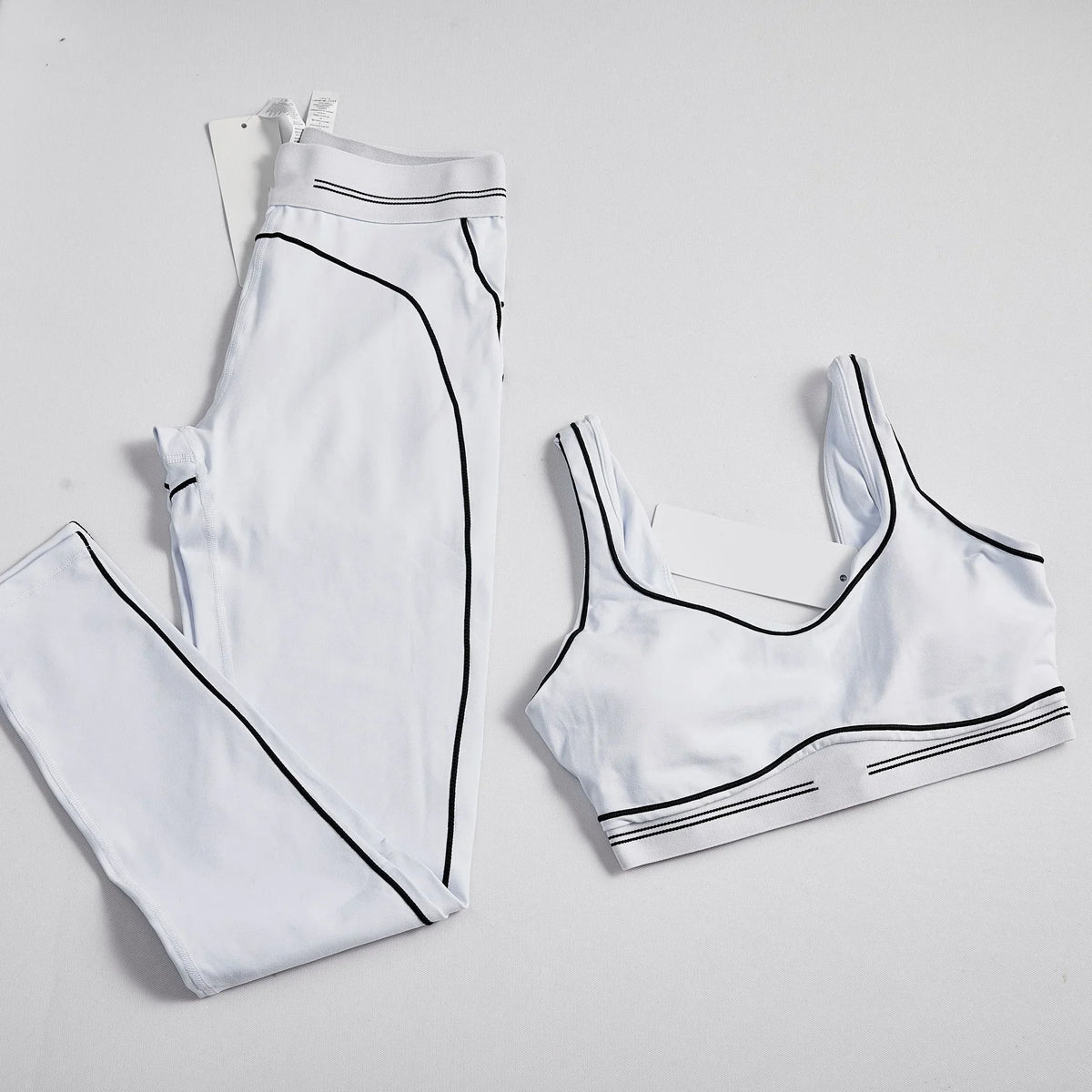 Women's 2-piece yoga set with striped leggings and breathable crop top for workouts and running