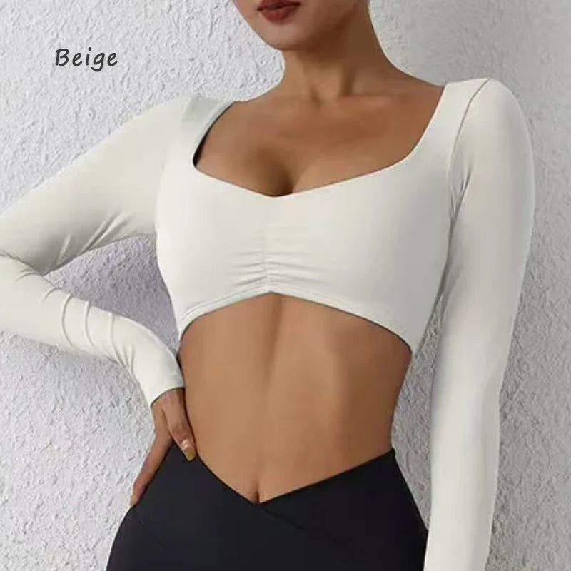 Nylon women's long-sleeved yoga top with pleats from The Clothing Company Sydney, designed for fitness and waist-tightening.