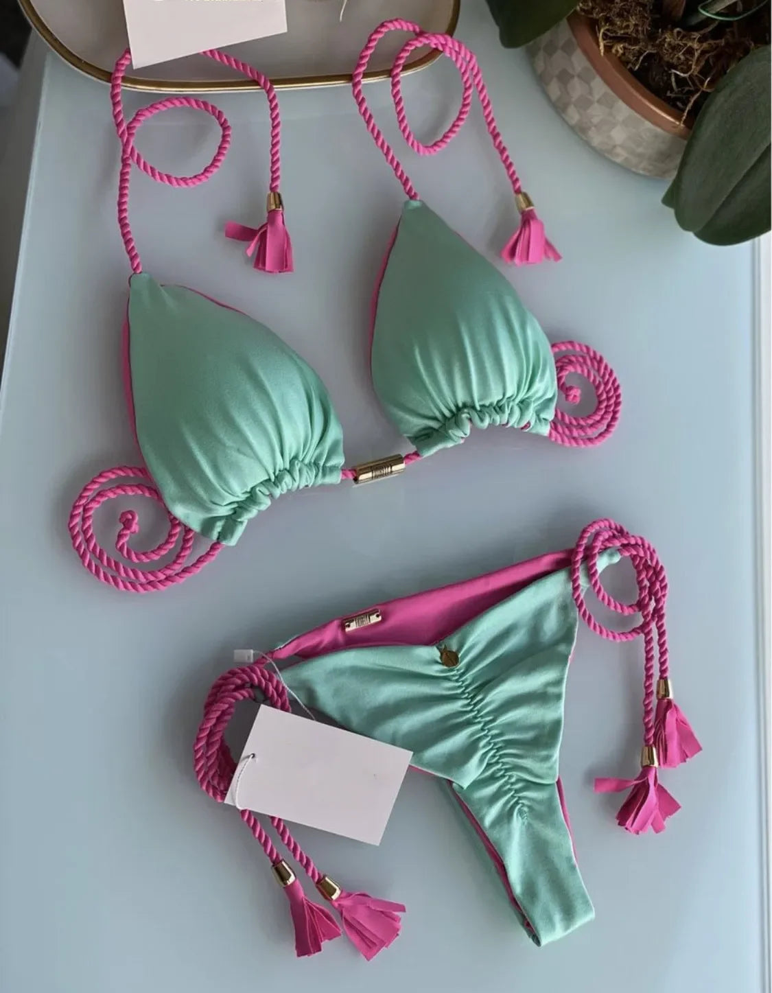 Women's backless rope triangle swimsuit by The Clothing Company Sydney, featuring a stylish bikini design with minimal coverage.
