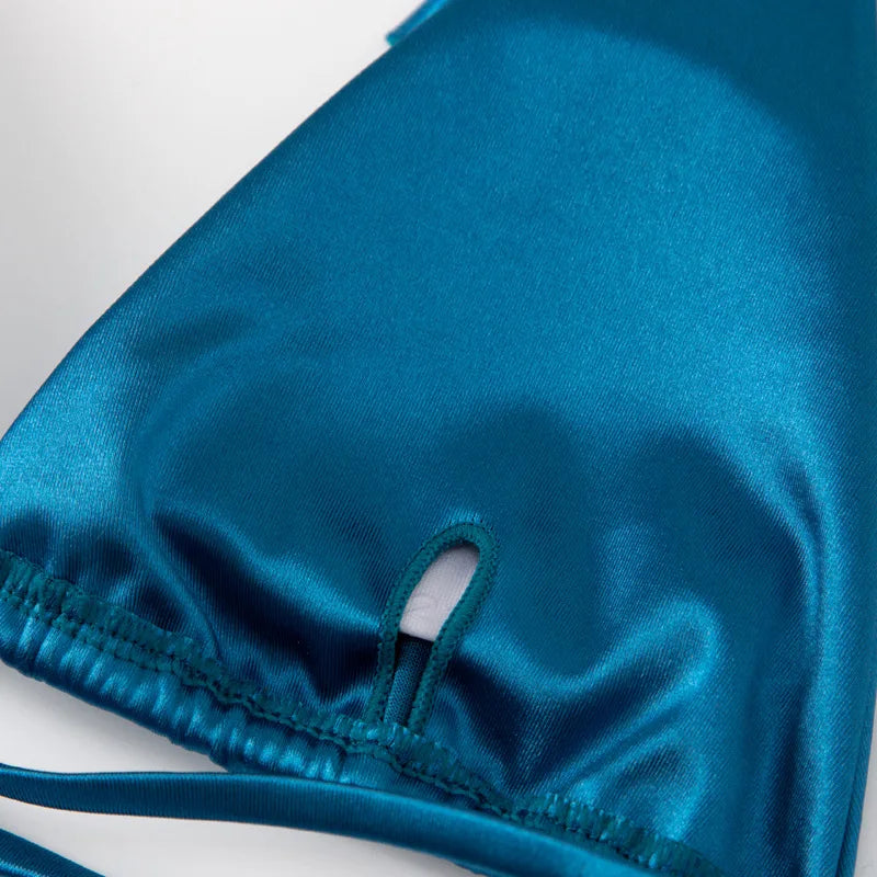 Two-piece Brazilian metallic satin swimsuit with halter top and high-cut bottoms, ideal for beachwear and swimming.